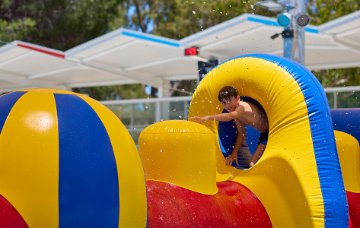 Child playing on the pool inflatable